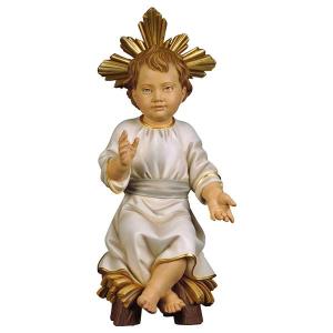 Infant Jesus sitting on manger with Halo